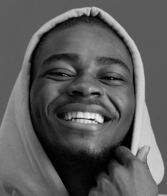 Man in a hoodie laughing