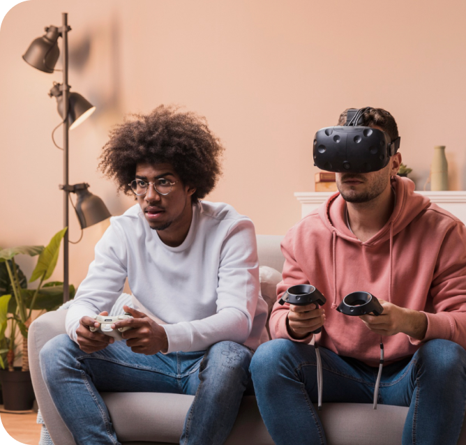 Two roommates gaming on a sofa