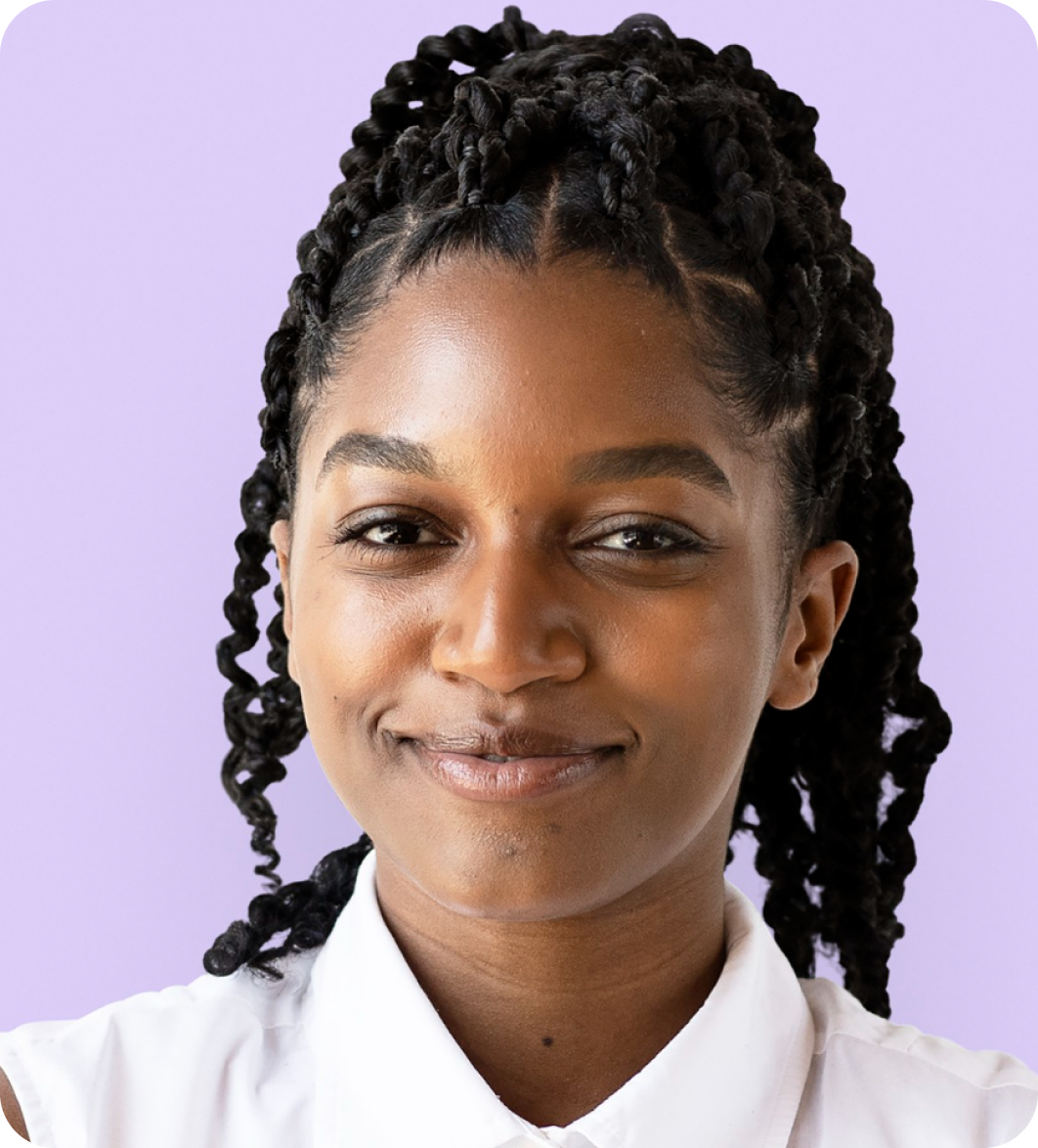 Smiling woman with braids, ready to list her spare room